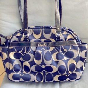 Coach Diaper bag, very roomy & comfortable to carry.